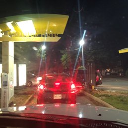 a red car at a gas station