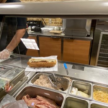Subway - a man preparing food in a deli - Sandwiches Near Me - San Antonio, Texas
