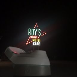Roy's sign at night. Water bottle for scale.