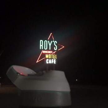 Roy's Motel & Cafe - Roy's sign at night. Water bottle for scale. - Gas Stations Near Me - Amboy, California