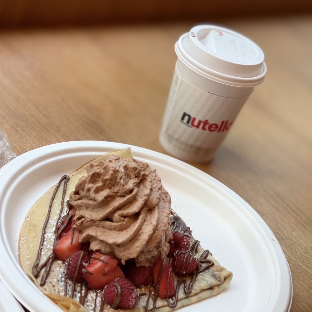 Nutella Cafe - Crepe with strawberries and Nutella cream and a mocha - Desserts Near Me - Chicago, Illinois Nutella Cafe - Crepe with strawberries and Nutella cream and a mocha - Desserts Near Me - Chicago, Illinois