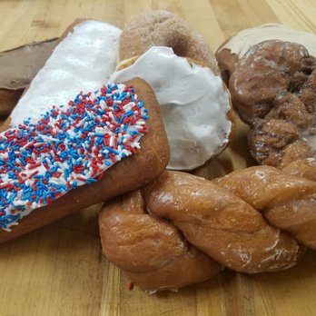 Bloomer Bakery - a variety of doughnuts on a wooden table - Bakeries Near Me - Bloomer, Wisconsin