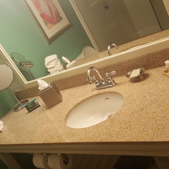 Hotel Indigo Sarasota - Bathroom with lots of toiletries - Hotels Near Me - Sarasota, Florida Hotel Indigo Sarasota - Bathroom with lots of toiletries - Hotels Near Me - Sarasota, Florida