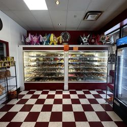 Panaderia Azteca Mexico - Pan Dulce display case, other items for sale within the bakery