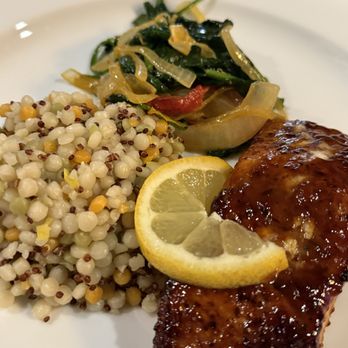 Edgar's Bistro - Summer 2025 menu: Seared Salmon with sweet chili sauce, sautéed spinach, and roasted red pepper medley,
confetti couscous - New American Near Me - Macon, Georgia