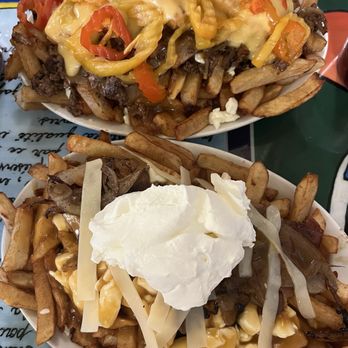 La Banquise - La Couvre-Feu (top) & La Savoyarde (bottom) - Poutineries Near Me - Montreal, Quebec