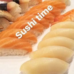 a white plate with sushi and other sushi items a white plate with sushi and other sushi items