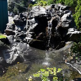 a pond with a waterfall a pond with a waterfall