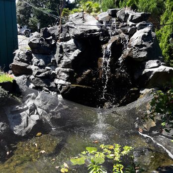 Unicorn Sports Bar - a pond with a waterfall - American Near Me - Ruston, Washington Unicorn Sports Bar - a pond with a waterfall - American Near Me - Ruston, Washington