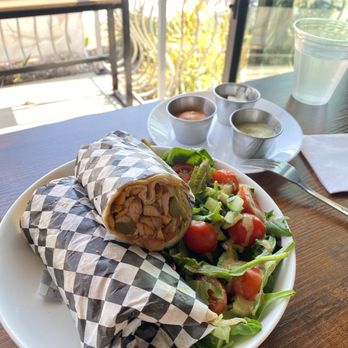 Angry AL's - Chicken Shawarma (pita wrap). Side salad was spring mix with cherry tomatoes, diced cucumbers, and honey mustard dressing. SO GOOD - Mediterranean Near Me - Huntington Beach, California