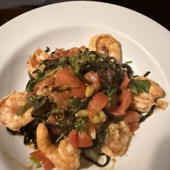 Nonna Luisa - Black squidink pasta w fresh tomatoes & arugula w garlic /olive oil. - Italian Near Me - Queens, New York Nonna Luisa - Black squidink pasta w fresh tomatoes & arugula w garlic /olive oil. - Italian Near Me - Queens, New York