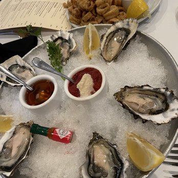 Scott's Seafood - Oysters on the half shell & calamari appetizer in the background - Seafood Near Me - San Jose, California Scott's Seafood - Oysters on the half shell & calamari appetizer in the background - Seafood Near Me - San Jose, California