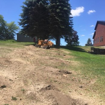 TJ's Lawn Service NY - a bulldozer on a hill - Lawn Services Near Me - Norwich, New York TJ's Lawn Service NY - a bulldozer on a hill - Lawn Services Near Me - Norwich, New York