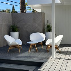 Elemental Design Group - Large geometric Porcelain tile adds texture to this mid century modern courtyard.