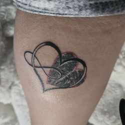 Rebel Ink - Thumb print tattoo in a heart