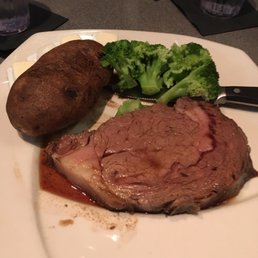 Prime Rib (medium rare) with Baked Potato and Broccoli. Came with a salad also. Prime Rib (medium rare) with Baked Potato and Broccoli. Came with a salad also.