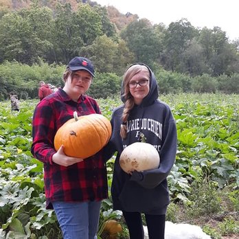The Sand Farm - two women holding pumpkins - Fruits & Veggies Near Me - Gays Mills, Wisconsin The Sand Farm - two women holding pumpkins - Fruits & Veggies Near Me - Gays Mills, Wisconsin