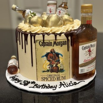 Exquisite Desserts - a cake with a bottle of alcohol - Bakeries Near Me - Palm Desert, California Exquisite Desserts - a cake with a bottle of alcohol - Bakeries Near Me - Palm Desert, California