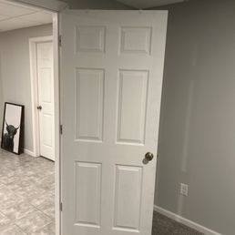 Door trimmed and able to open and close without hitting our new carpet. Door trimmed and able to open and close without hitting our new carpet.