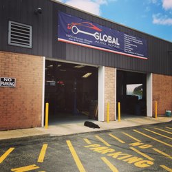 Global Auto Repair - Clyde enjoying the sunshine while we work away inside!