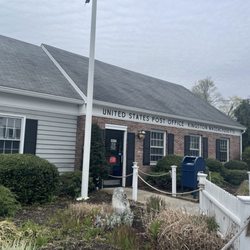 US Post Office - Clapboard and brick-faced facade.