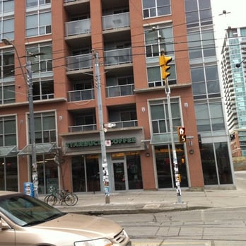 Starbucks - a car parked in front of a building - Coffee & Tea Near Me - Toronto, Ontario Starbucks - a car parked in front of a building - Coffee & Tea Near Me - Toronto, Ontario