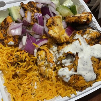 Gyro King - Chicken tikka over Rice. Half cooked - Falafel Near Me - Brooklyn, New York Gyro King - Chicken tikka over Rice. Half cooked - Falafel Near Me - Brooklyn, New York