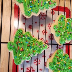 A.L.L. Sweet Shop & Bakery - Cut-out sugar cookies with frosting and sprinkles.