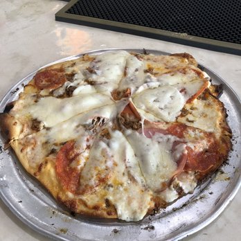 Sharky's Tavern - A little heavy on the cheese but it was delicious. - Pizza Near Me - Galveston, Texas