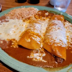 El Camino Restaurant - One ground beef and one pork enchilada with savory mole and rice and beans. Delicious every time!
