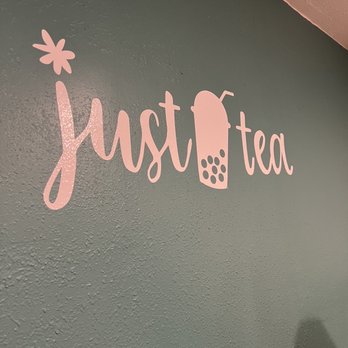 Just Tea - a person standing in front of a wall - Bubble Tea Near Me - Portland, Oregon