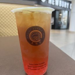 Peach fruit tea with strawberry boba Peach fruit tea with strawberry boba