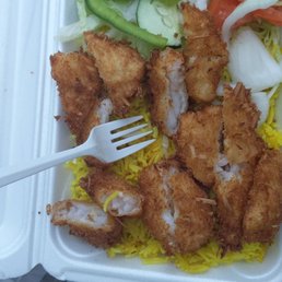 Coconut shrimp over rice.