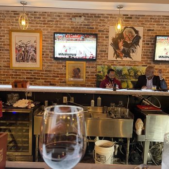 Victors - Bar photo- Red wine and hockey!! - New American Near Me - Florence, South Carolina Victors - Bar photo- Red wine and hockey!! - New American Near Me - Florence, South Carolina