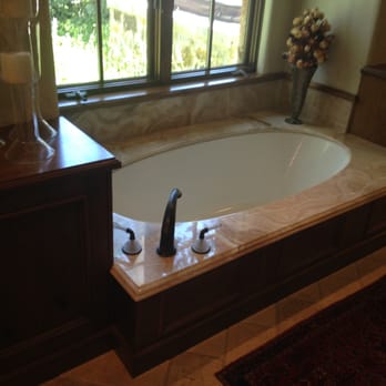 Dan's Plumbing - a bathtub in a bathroom - General Contractors Near Me