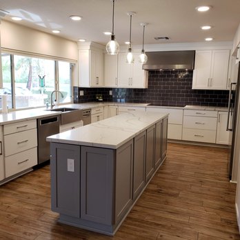 Sunset Tile & Bath - a kitchen with a large island - General Contractors Near Me - Glendale, Arizona