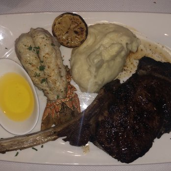 Flagler Steakhouse - Dry Aged Tomahawk Rib Chop with a Lobster Tail - Steakhouses Near Me - Palm Beach, Florida