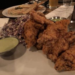 a plate of fried chicken with a side of coleslaw a plate of fried chicken with a side of coleslaw