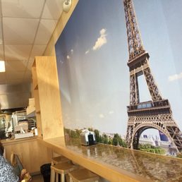 Eifel Tower overlooking the open kitchen and tables Eifel Tower overlooking the open kitchen and tables
