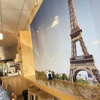 My Sweet Art - Eifel Tower overlooking the open kitchen and tables - French Near Me - Cape Coral, Florida My Sweet Art - Eifel Tower overlooking the open kitchen and tables - French Near Me - Cape Coral, Florida