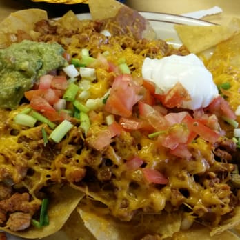 El Rincon - Nachos Jaliscienses, beans, pork, cheese, onion, tomatoes,  guacamole - Mexican Near Me - Ashton, Idaho