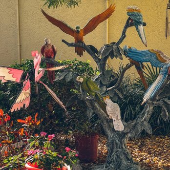 The Stuffed Pig - a group of birds perched on a tree - Breakfast & Brunch Near Me - Marathon, Florida