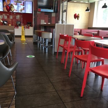 McDonald's - Inside, balloons represent sanitized table but it's full of crumbs and smuges. Bathroom needs a good cleaning too!!! - Fast Food Near Me - Stockbridge, Georgia