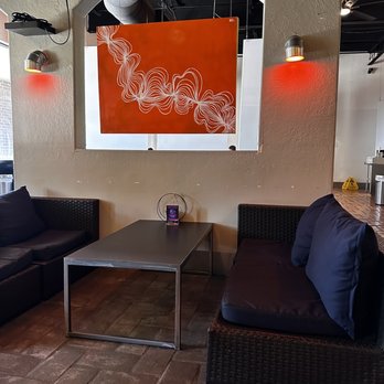 NOKturne Juice Bar & World Food - a living room with couches and tables - Vegetarian Near Me - Houston, Texas
