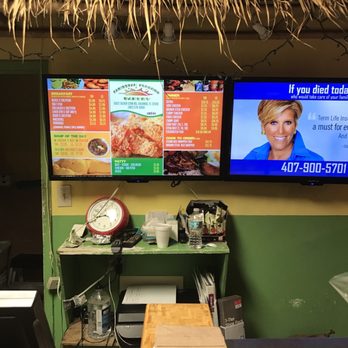 Caribbean Sunshine Bakery - a large tv screen with a picture of a woman on it - Caribbean Near Me - Orlando, Florida Caribbean Sunshine Bakery - a large tv screen with a picture of a woman on it - Caribbean Near Me - Orlando, Florida