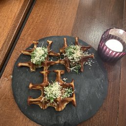 A waffle appetizer with some super salty concoction on top. A waffle appetizer with some super salty concoction on top.