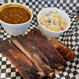 The 3 rib plate with sides of bbq beans, coleslaw and sausage. The 3 rib plate with sides of bbq beans, coleslaw and sausage.