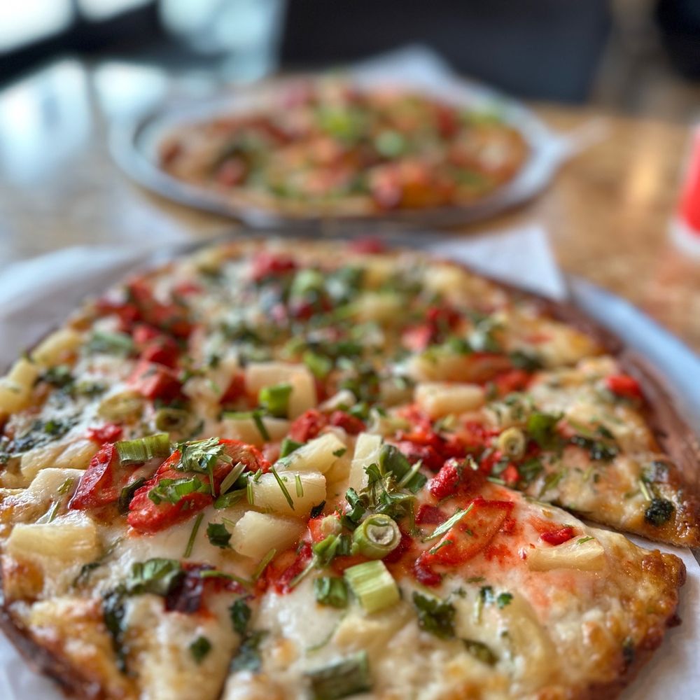 Curry Pizza - two pizzas on a table - Pizza Near Me - West Valley City, Utah Curry Pizza - two pizzas on a table - Pizza Near Me - West Valley City, Utah