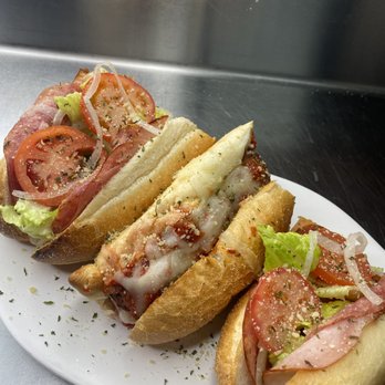 Flame Pizzeria - three sub sandwiches on a plate - Pizza Near Me - Orlando, Florida Flame Pizzeria - three sub sandwiches on a plate - Pizza Near Me - Orlando, Florida