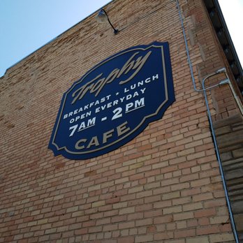 Trophy Cafe - a blue sign on the side of a brick building - Cafes Near Me - Duluth, Minnesota